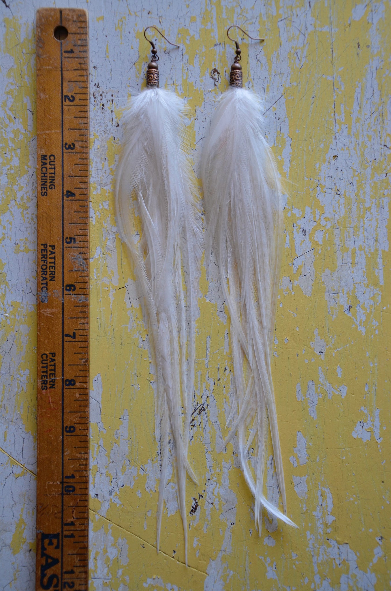 white feather earrings